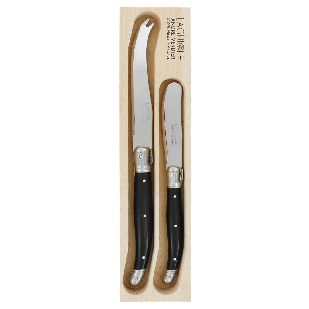 A set of two Laguiole Andre Verdier steak knives in their original light wood presentation box, featuring black handles and silver blades.