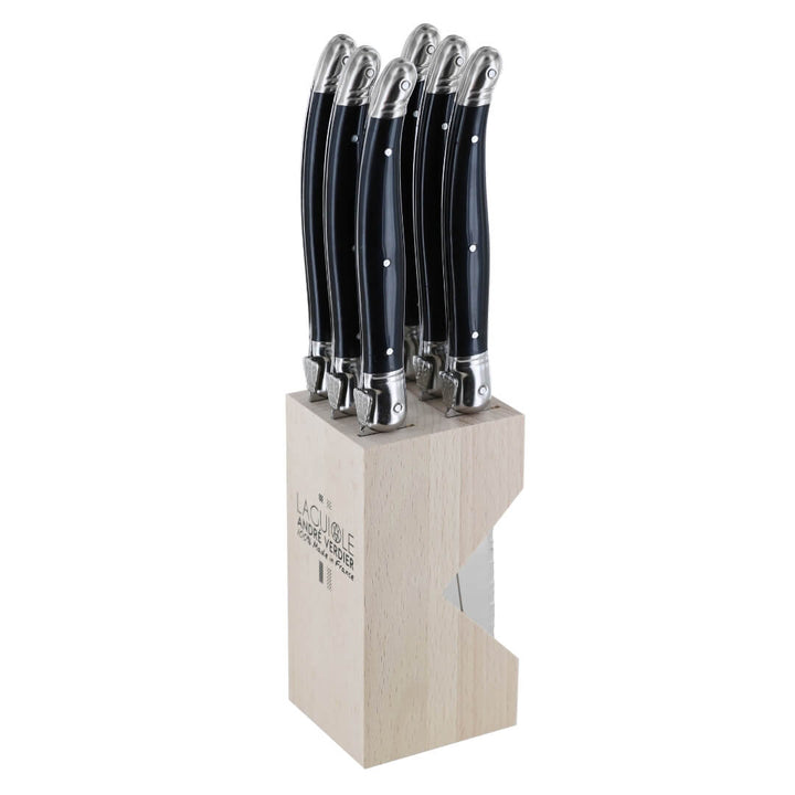 A 6-piece steak knife set with black handles and silver bolsters, presented in a light natural wood block on a white background. The block features the 'La Table des Champs' brand logo.