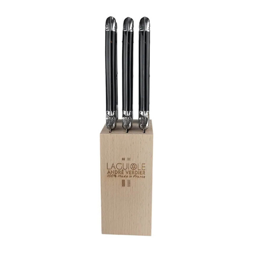 Set of three knives with black handles in a wooden block on a white background, featuring the brand 'Lagoule Andre Verdier'.